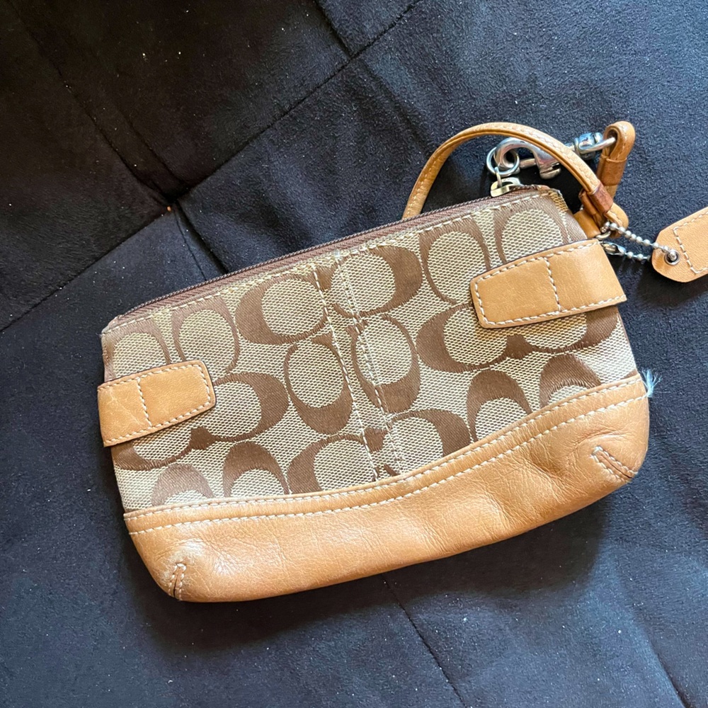 COACH tan logo wristlet with C and leather bottom